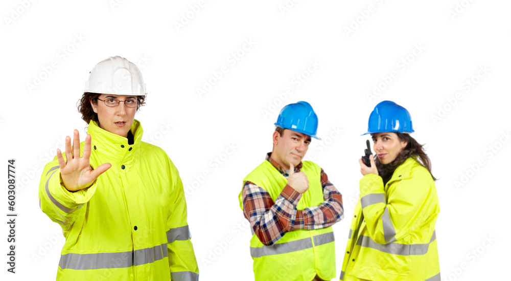 Three construction workers over a white background. Focus at front Three construction workers over a white background. Focus at front
