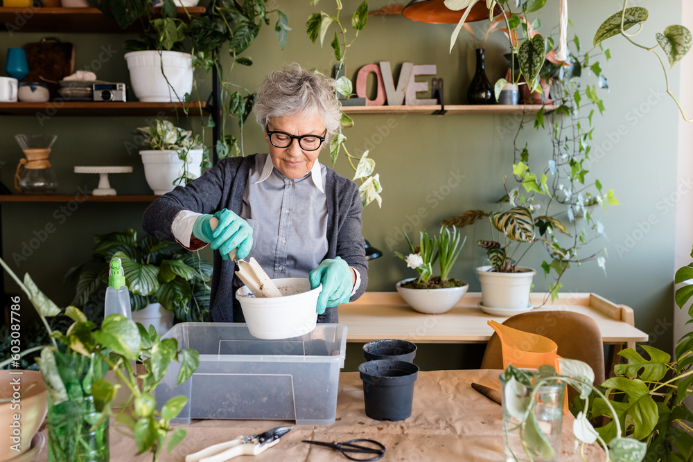 Woman Filling Vase With Dirt Woman Filling Vase With Dirt