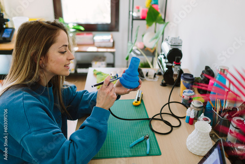 Woman using an airbrush photo