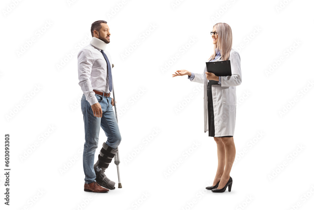 Female doctor talking to an injured man with an orthopedic boot and cervical collar Female doctor talking to an injured man with an orthopedic boot and cervical collar