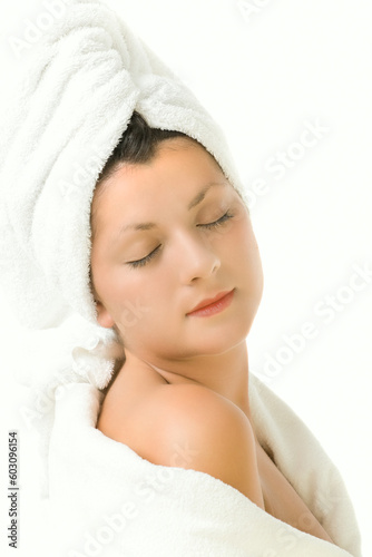 Portrait of a young sexy woman relaxing in the spa, isolated on white background