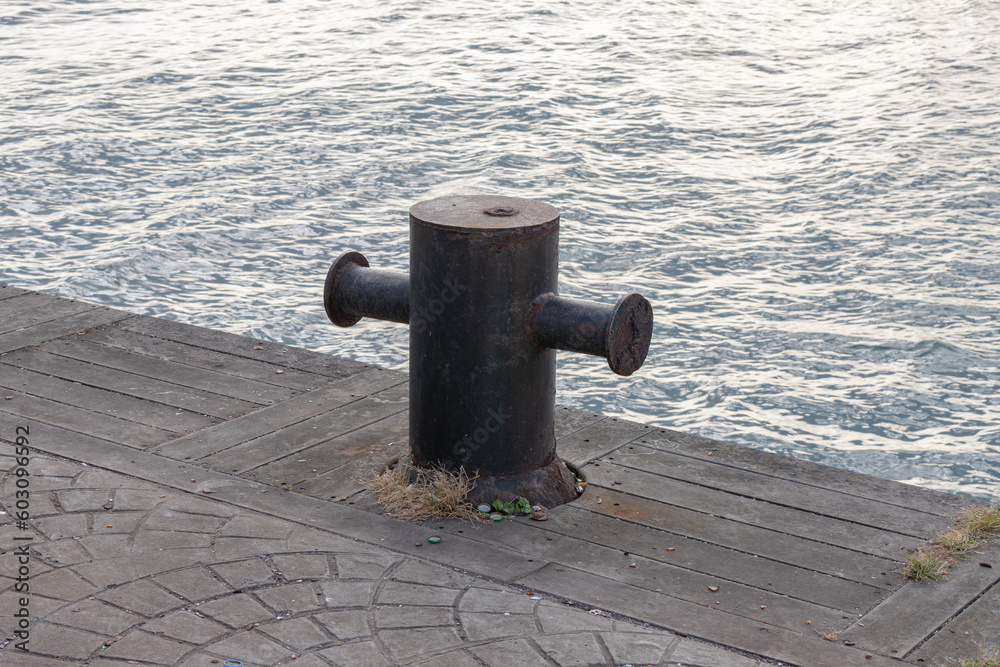 wharf anchor used to moor the ship. Selective focus, noise effect. wharf anchor used to moor the ship. Selective focus, noise effect.