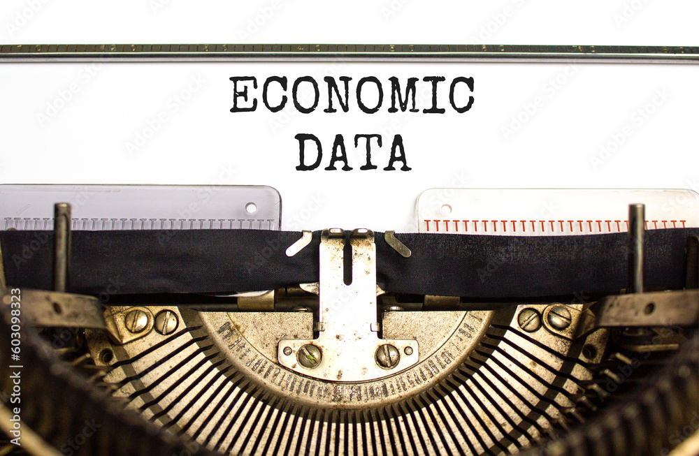 Economic data symbol. Concept words Economic data typed on white paper on old retro typewriter. Beautiful white background. Business economic data concept. Copy space.