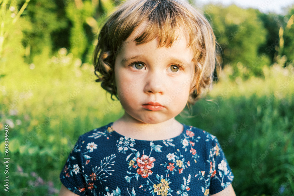 Little toddler girl outdoors in nature in summer Little toddler girl outdoors in nature in summer