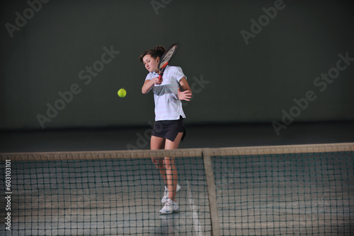one woman playing tennis sport indoor © Designpics