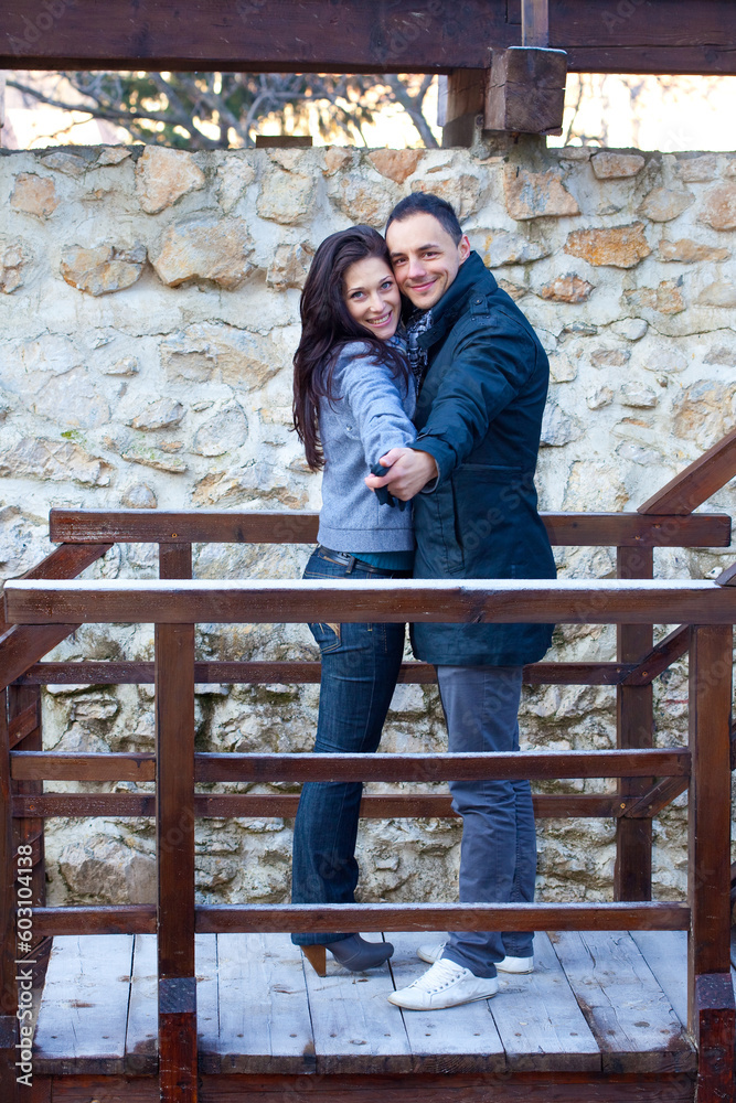 Young couple playing around in the nature - front view. Young couple playing around in the nature - front view.
