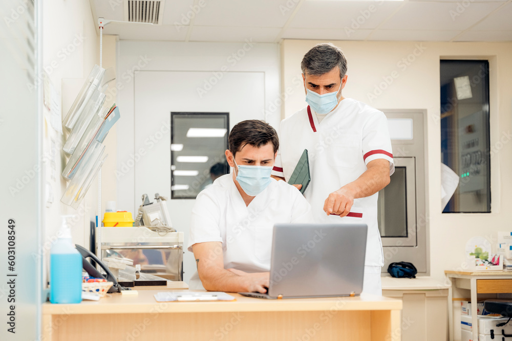 Staff of hospital working with laptop Staff of hospital working with laptop