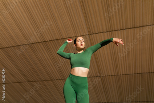 young ballerina dancing outdoors in the city