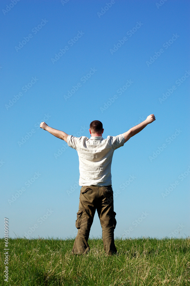man relaxing on sky background