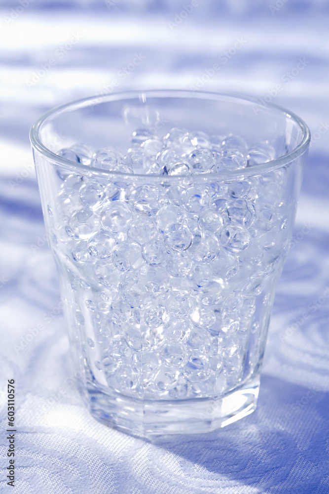 The empty glass stands on the shined plane