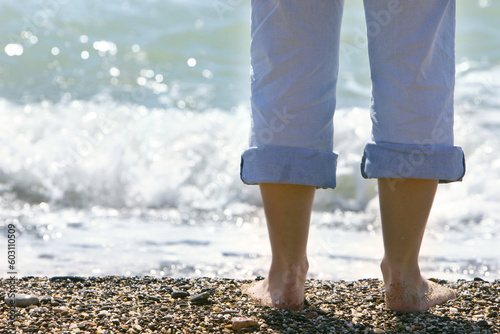 close up of female feet on pebble beach © Designpics