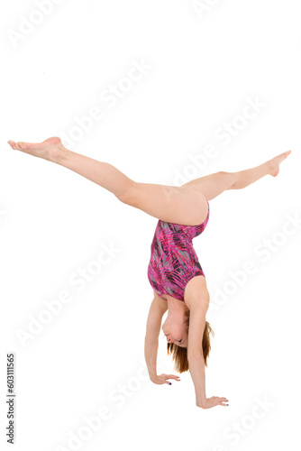 Caucasian teenage girl in gymnastic poses on white background