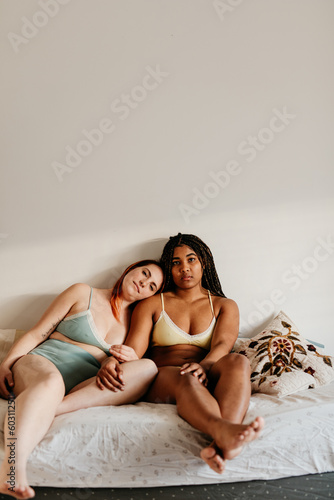 portrait of two models sitting together  photo