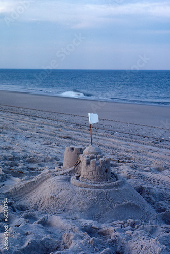 Sand castle sandcastle on Delaware beach late afternoon evening sunset photo