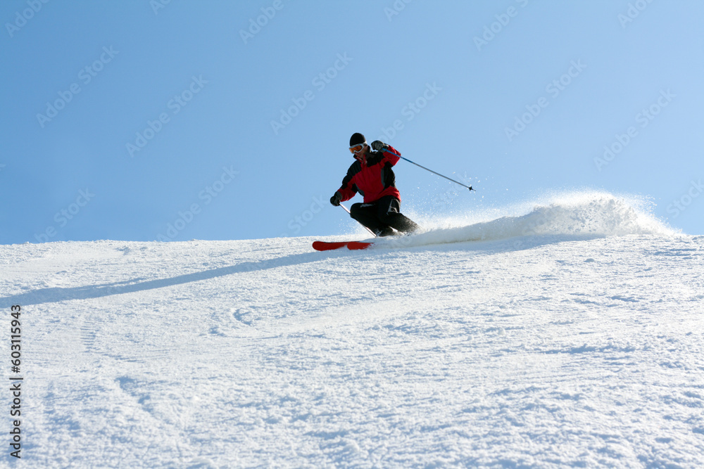 Man in red jacket goes on mountain ski Man in red jacket goes on mountain ski