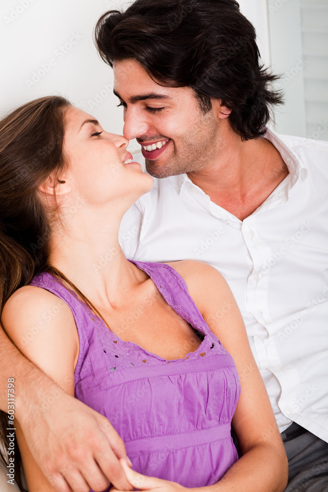 portrait of romantic young couple kissing eachother in causel wear portrait of romantic young couple kissing eachother in causel wear