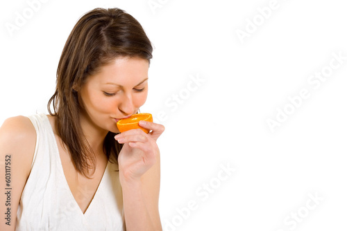 young woman with orange slice over white background