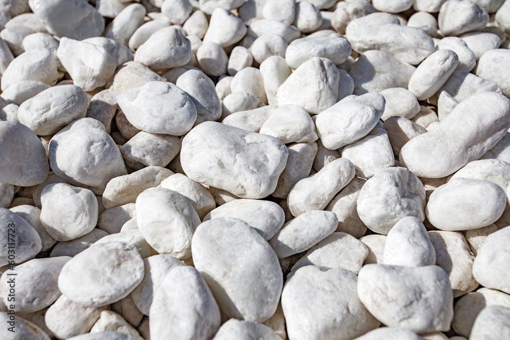 Stones white decorative in bulk, selective focus Stones white decorative in bulk, selective focus