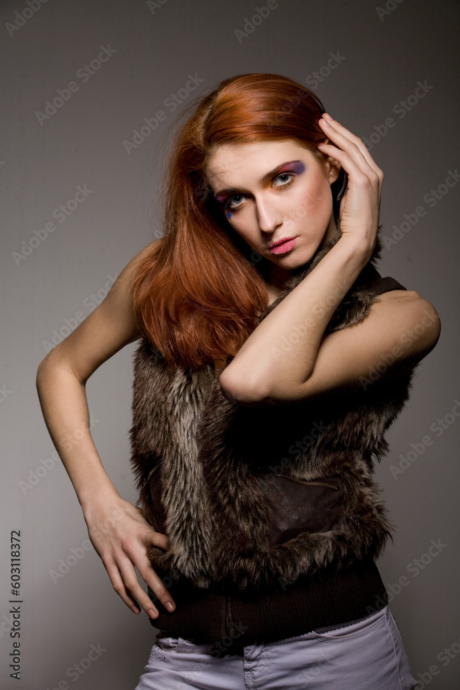 studio shot of a beautiful young woman on dark background