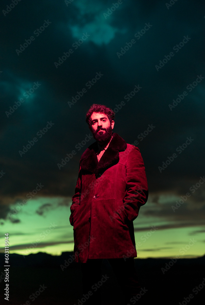 Surreal portrait of standing man with sunset sky Surreal portrait of standing man with sunset sky