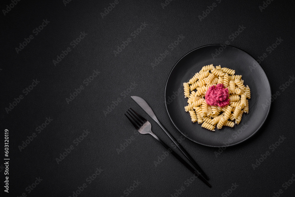 Delicious fusilli pasta with beetroot pesto, parmesan, salt and spices Delicious fusilli pasta with beetroot pesto, parmesan, salt and spices