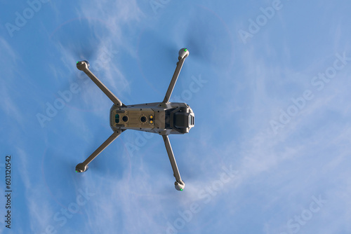 Rivne region, Ukraine - September 17, 2022 A civilian drone flies in the Ukrainian sky. Drone high in the sky