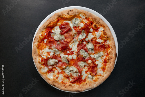 Pizza top view on dark background