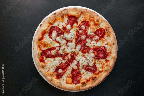 Pizza top view on dark background