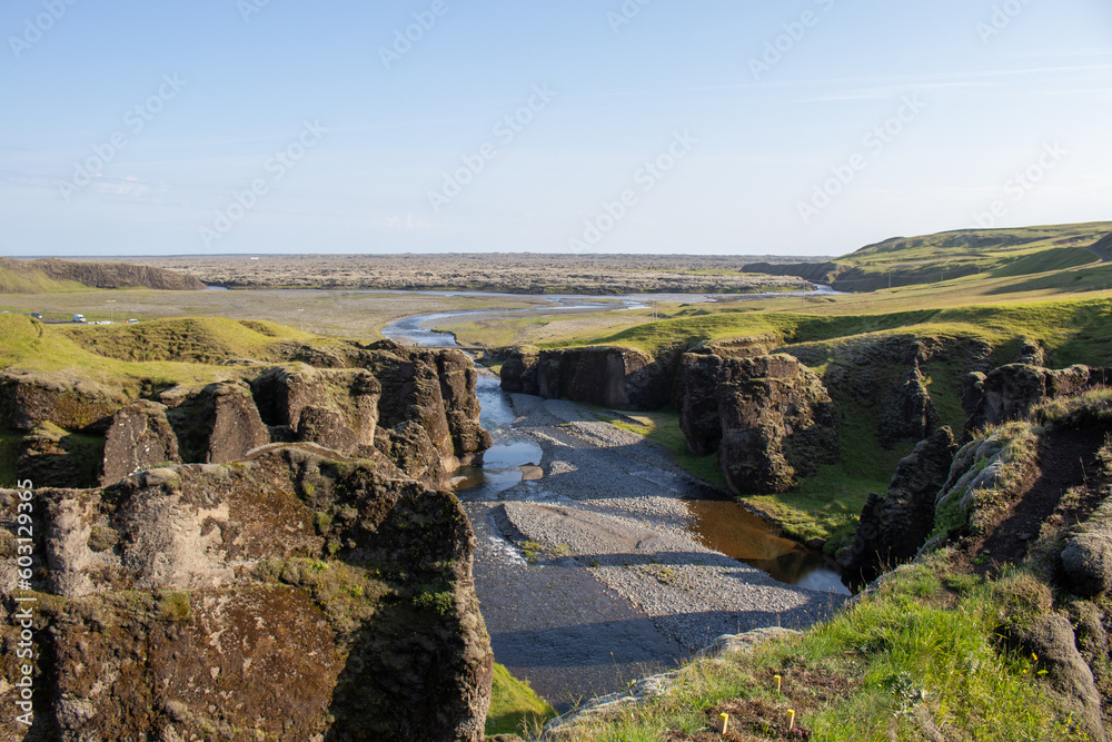 View of the cliffs and a river from above a Canyon Iceland