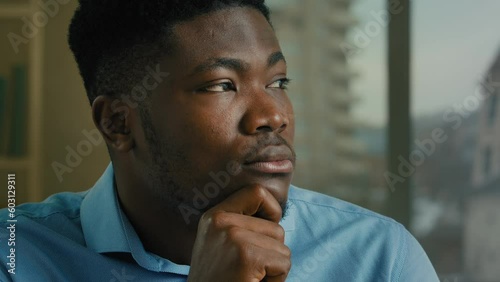 Head shot African American man ethnic thoughtful businessman think hold hand on chin doubt decision challenge solving business idea looking at camera nod head decide solution accept strategy support