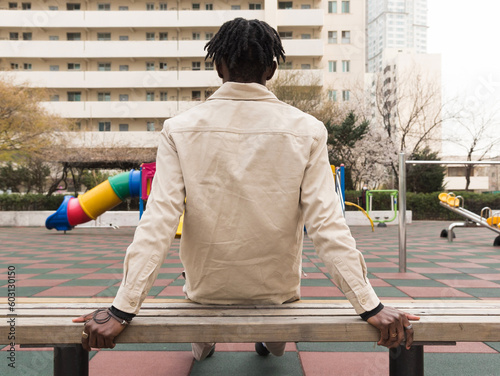 Man looking at the playground photo