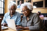 Multiracial senior woman holding laptop laughing while sitting with friend in cafe. Happy, wireless technology, coffee, togetherness, support, assisted living, retirement concept. Generative AI