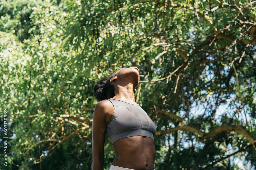 Exercising body and mind, woman doing yoga in the park. Exercising body and mind, woman doing yoga in the park.