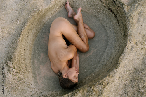 Naked Female On Rocks