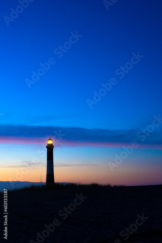 Beautiful view of historic Fire Island Lighthouse along Fire Island National Seashore on Long Island New York seen at evening sunset.