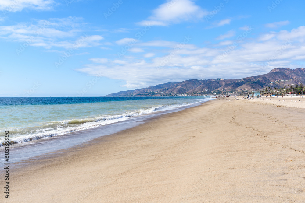 Magnificent sandy beach on the coast of California on a clear autumn day