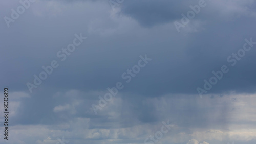 Fototapeta Naklejka Na Ścianę i Meble -  Cloudy in sky with rainfall, A nimbostratus cloud is a multi-level, amorphous, nearly uniform and often dark grey cloud that usually produces continuous rain, snow or sleet, Horizon nature background.