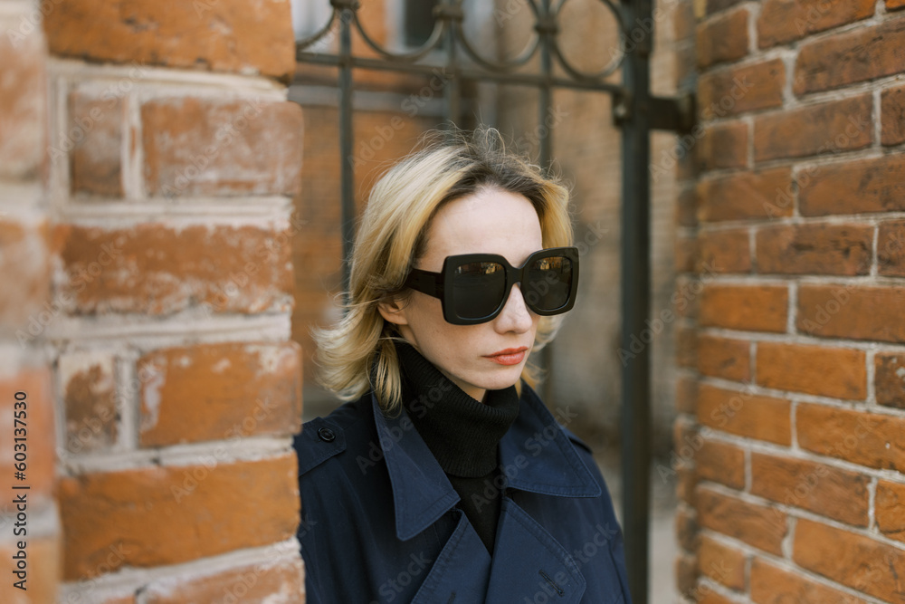 Woman with sunglasses on the street in closeup Woman with sunglasses on the street in closeup
