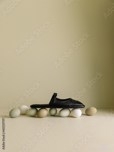 Leather sandals on coloured eggs photo