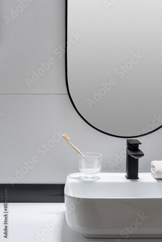 Fotografija minimalistic design in hotel washroom with washbowl and faucet