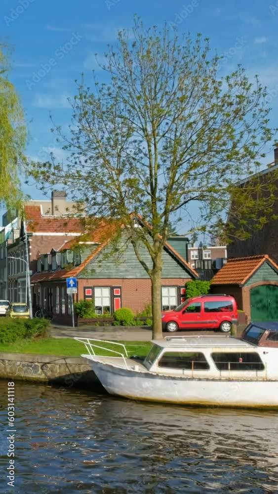 Boats and houses in canal. Harlem, Netherlands