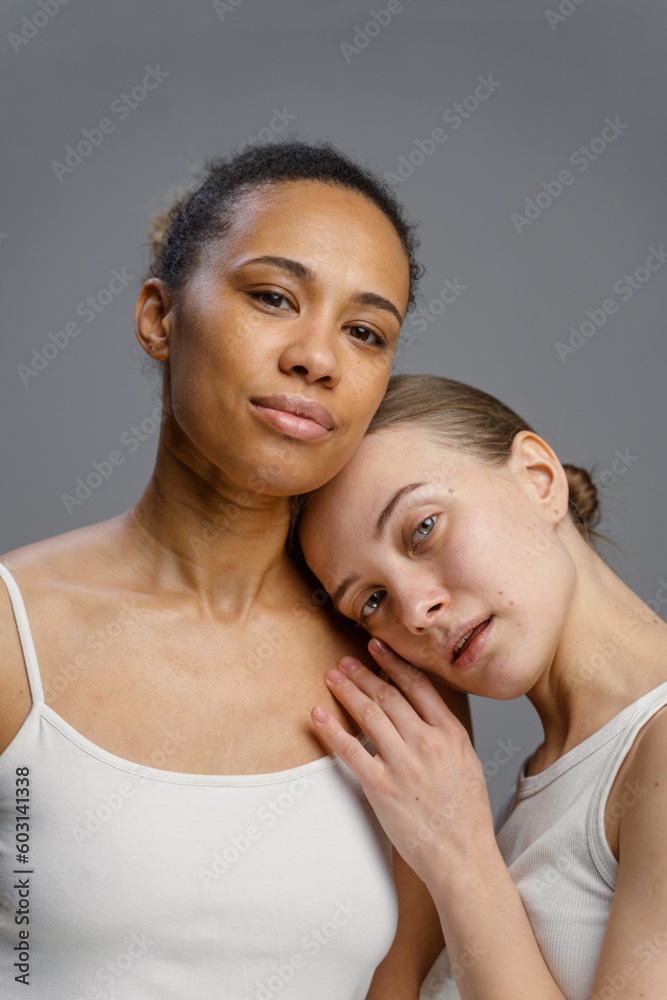 Two women pose in the studio Two women pose in the studio