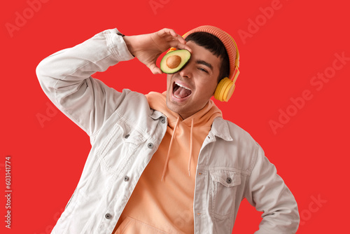 Happy young man in headphon...