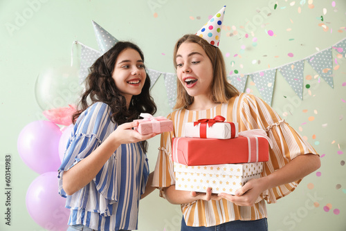 Happy young women with gift...