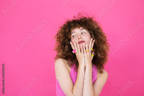 Stylish young woman touching face