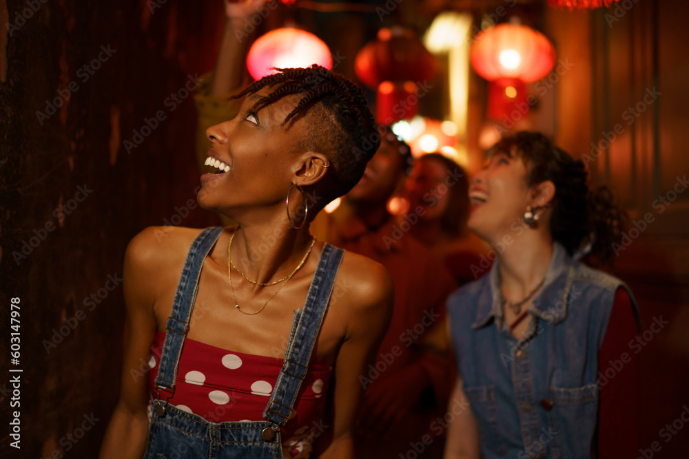 Trendy group of friends distracted by something Trendy group of friends distracted by something