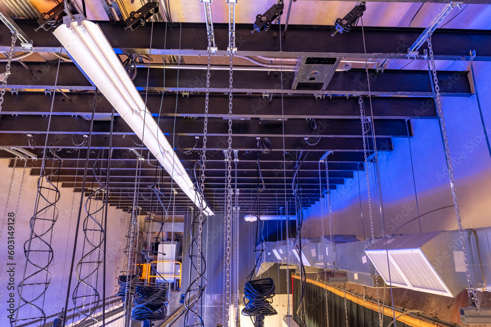 Theater stage rigging with theatrical equipment, lighting, supports
