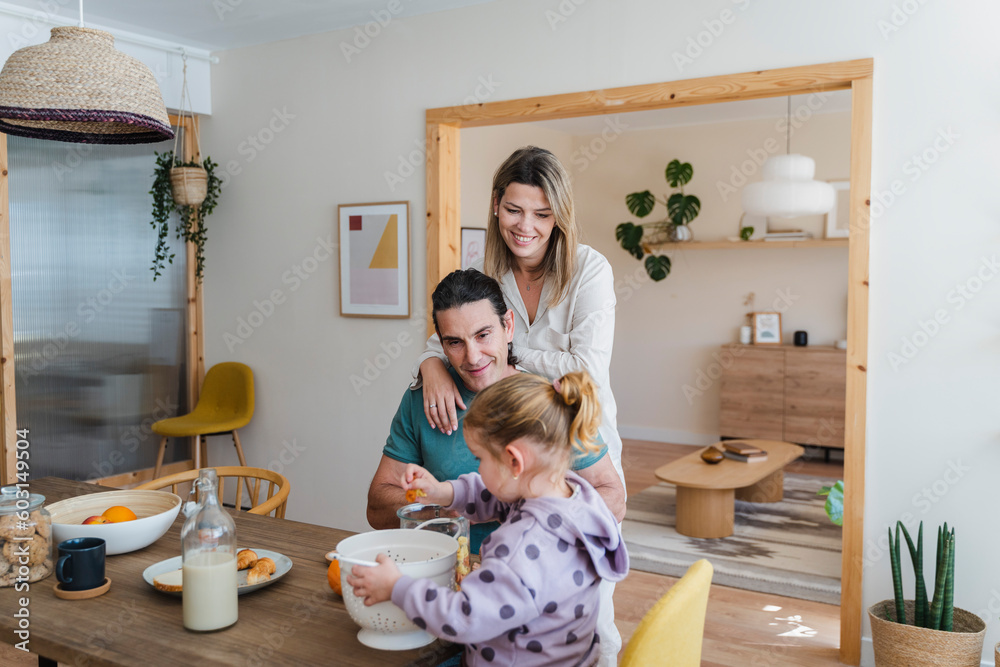 Happy Family Having Breakfast Together At Home Happy Family Having Breakfast Together At Home