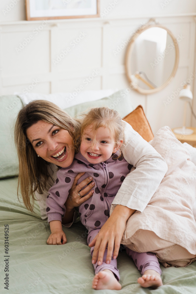 Laughing Mom Playing With Her Daughter At Home Laughing Mom Playing With Her Daughter At Home