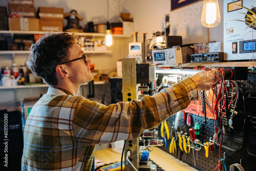 Master working in repair shop photo